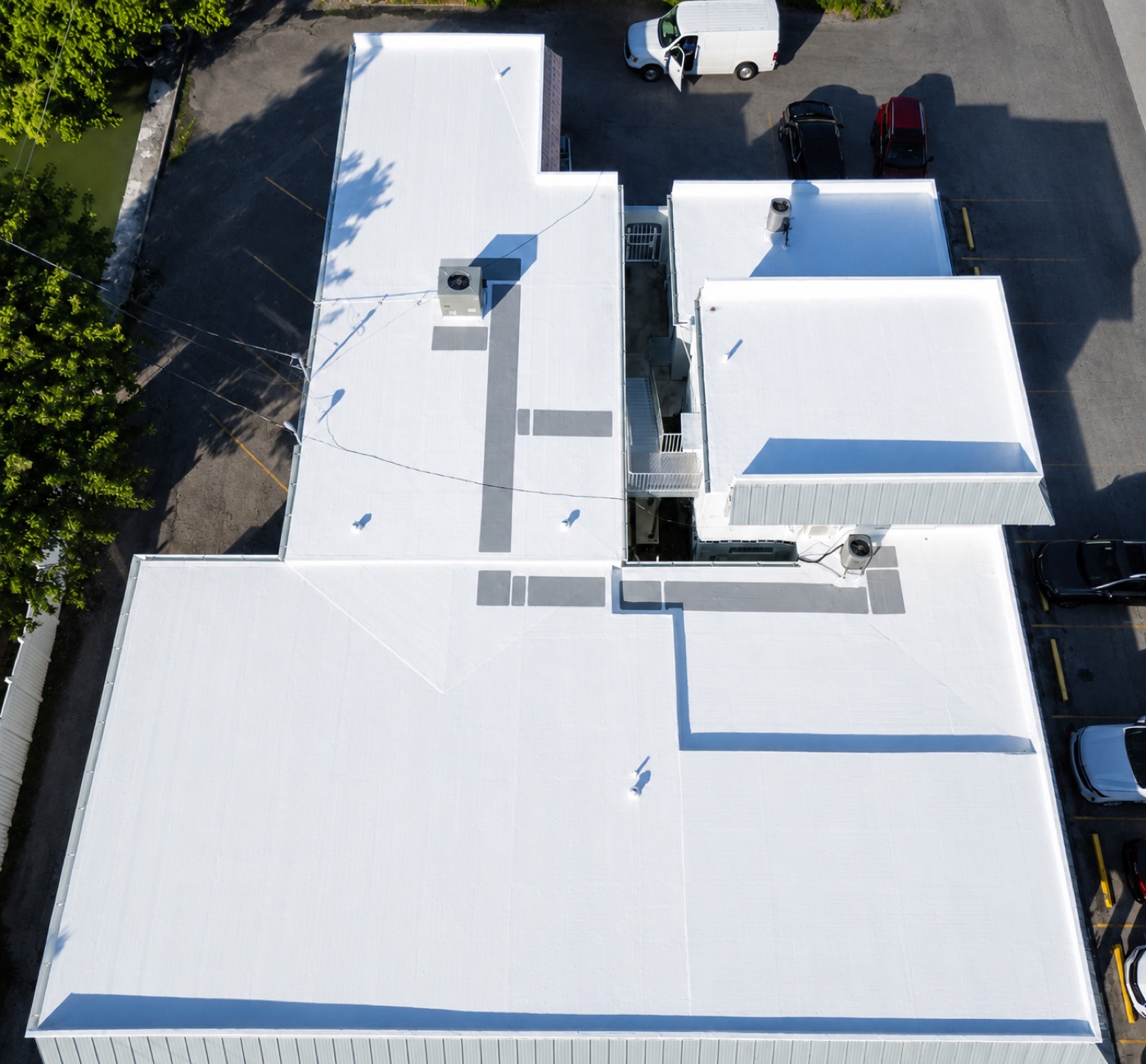 Commercial flat roof membrane installation, aerial view, Miami-Dade