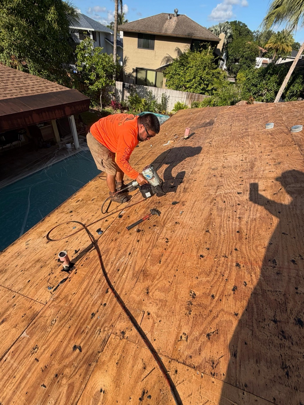 Kaizen Roofing crew installing new roof deck panels
