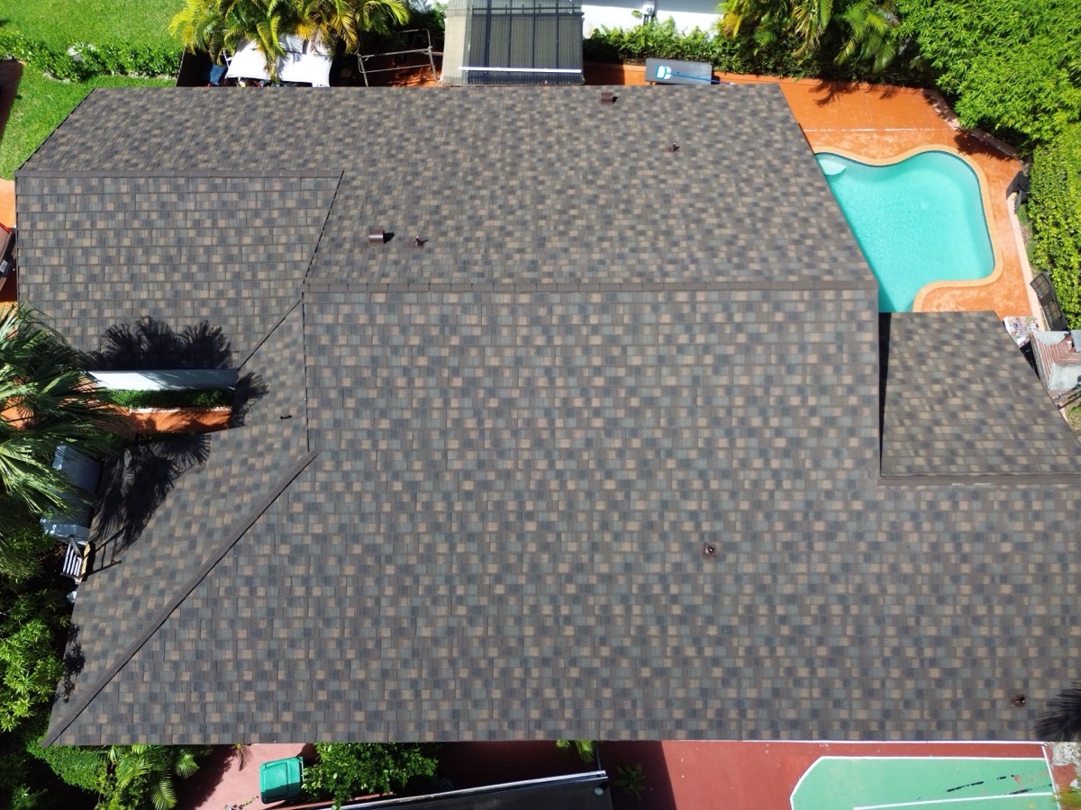 Completed asphalt shingle roof replacement on a home in Cutler Bay, FL